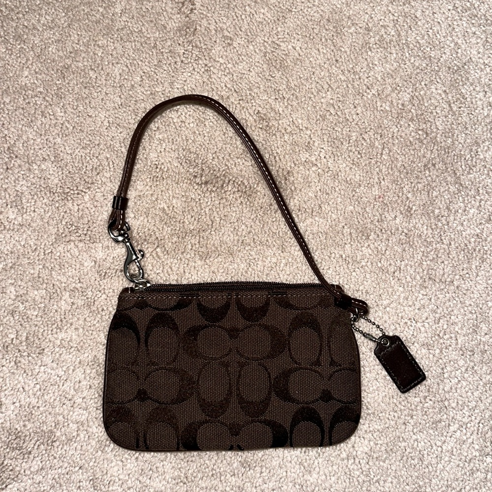 Small brown coach wristlet.